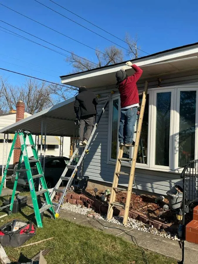 Restoration crew performing exterior repair in Boone